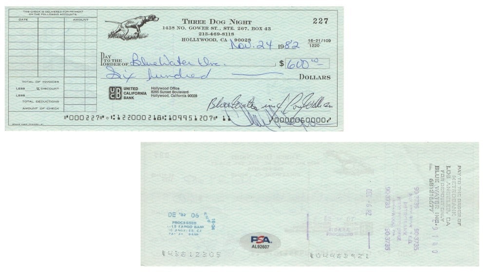 Bank Check Signed by Negron and Wells Three Dog Night JSA Authenticated: Bank Check Signed by Negron and Wells Three Dog Night JSA Authenticated This is an original bank check autographed by Chuck Negron and Cory Wells of Three Dog Night. The autograph has been authenticat