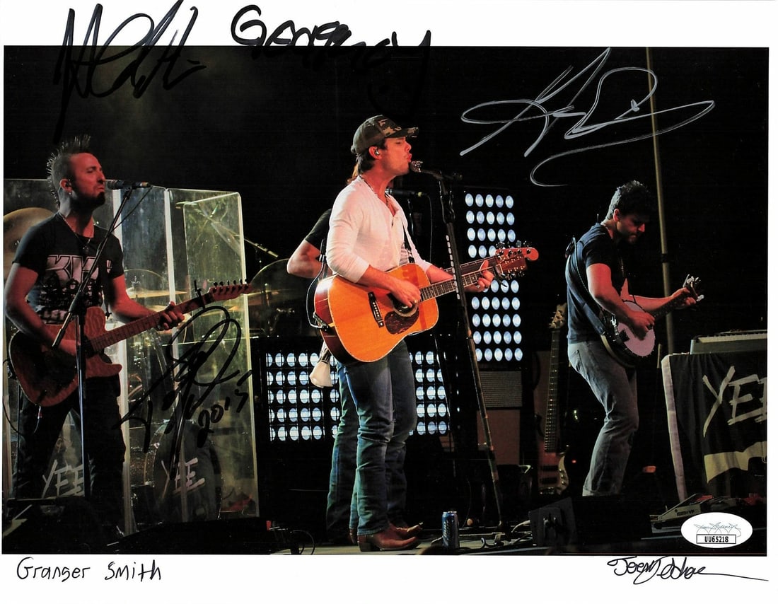 8.5x11 Photo Signed by Granger Smith Band and Photographer JSA Authenticated: 8.5x11 Photo Signed by Granger Smith Band and Photographer JSA Authenticated This is a professionally printed 8.5x11 inch cardstock photograph featuring signatures from Granger Smith and the other two