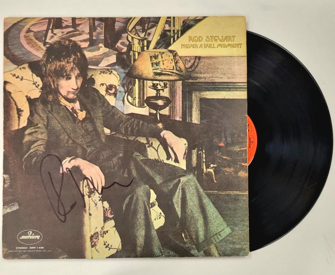 Never a Dull Moment album cover autographed by Rod Stewart Beckett authenticated: Never a Dull Moment album cover autographed by Rod Stewart Beckett authenticated This is an original 'Never a Dull Moment' vinyl album cover signed by Rod Stewart. The autograph is authenticated by Be