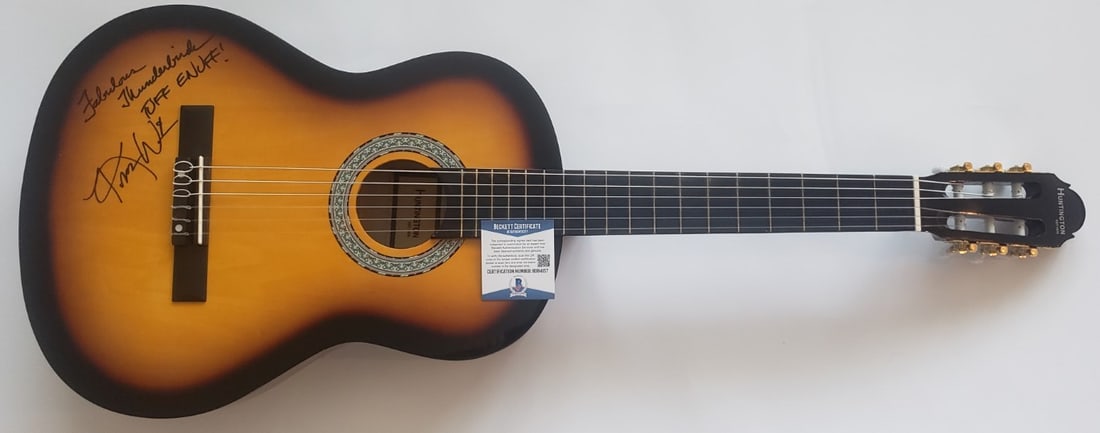 Kim Wilson Autographed Acoustic Guitar Fabulous Thunderbirds Beckett Authenticated: Kim Wilson Autographed Acoustic Guitar Fabulous Thunderbirds Beckett Authenticated This is an authentic acoustic guitar autographed by Kim Wilson, the renowned vocalist and harmonica player of the Fab