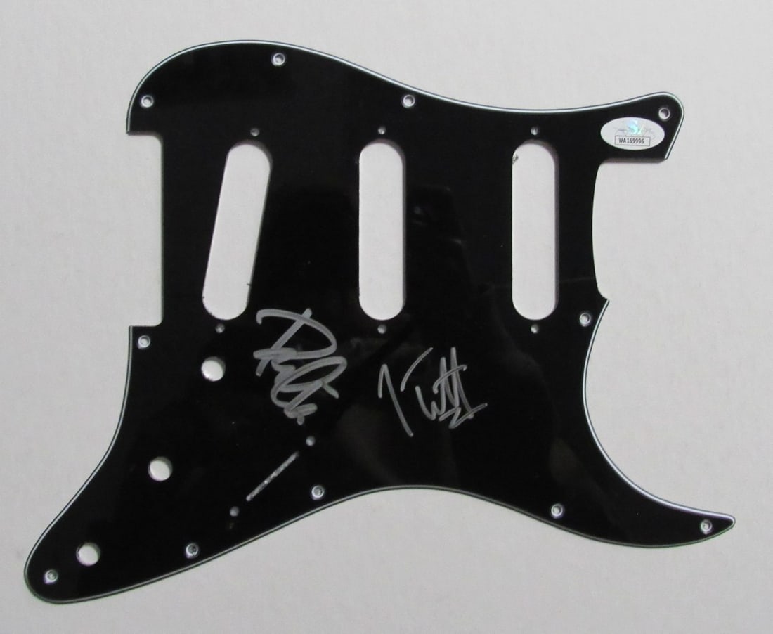 Def Leppard Signed Guitar Pickguard JSA Joe Elliott Phil Collen: Def Leppard Signed Guitar Pickguard JSA Joe Elliott Phil Collen This is an original guitar pick guard hand signed by Joe Elliott and Phil Collen of Def Leppard. The autographs are authenticated by Jam