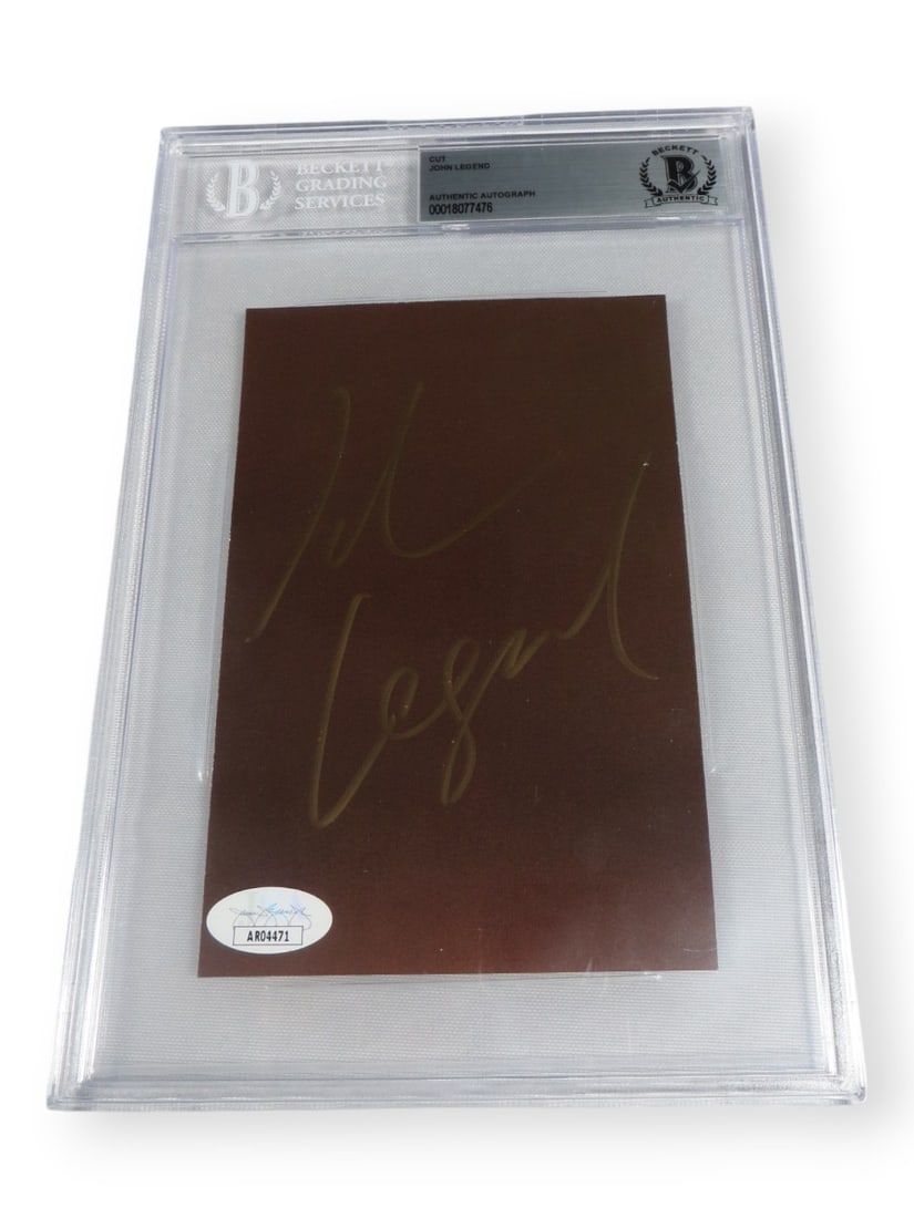 John Legend Autographed Cut Signature Beckett Authenticated 6x9: John Legend Autographed Cut Signature Beckett Authenticated 6x9 This is an original cut signature of the legendary singer John Legend, encapsulated and authenticated by Beckett Authentication Services