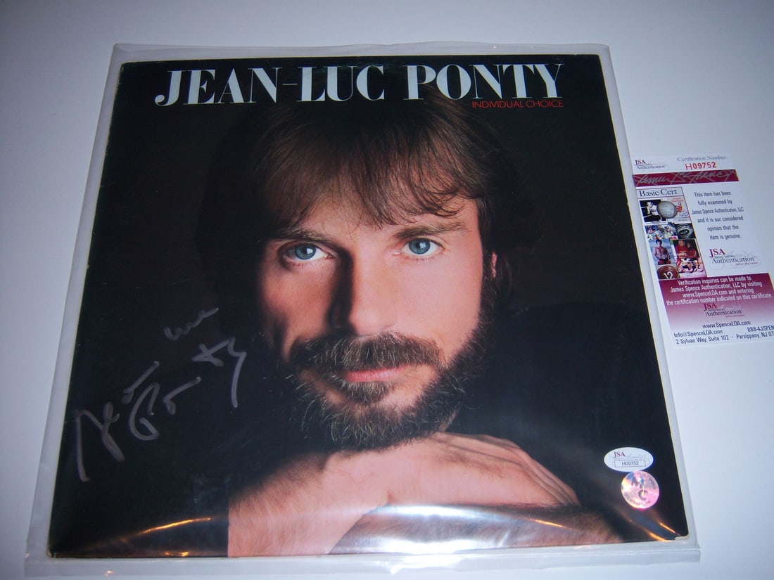 Signed Jean-Luc Ponty Individual Choice LP with JSA COA: Signed Jean-Luc Ponty Individual Choice LP with JSA COA This is an original vinyl LP record album titled 'Individual Choice' by Jean-Luc Ponty. The album cover features a close-up portrait of the arti