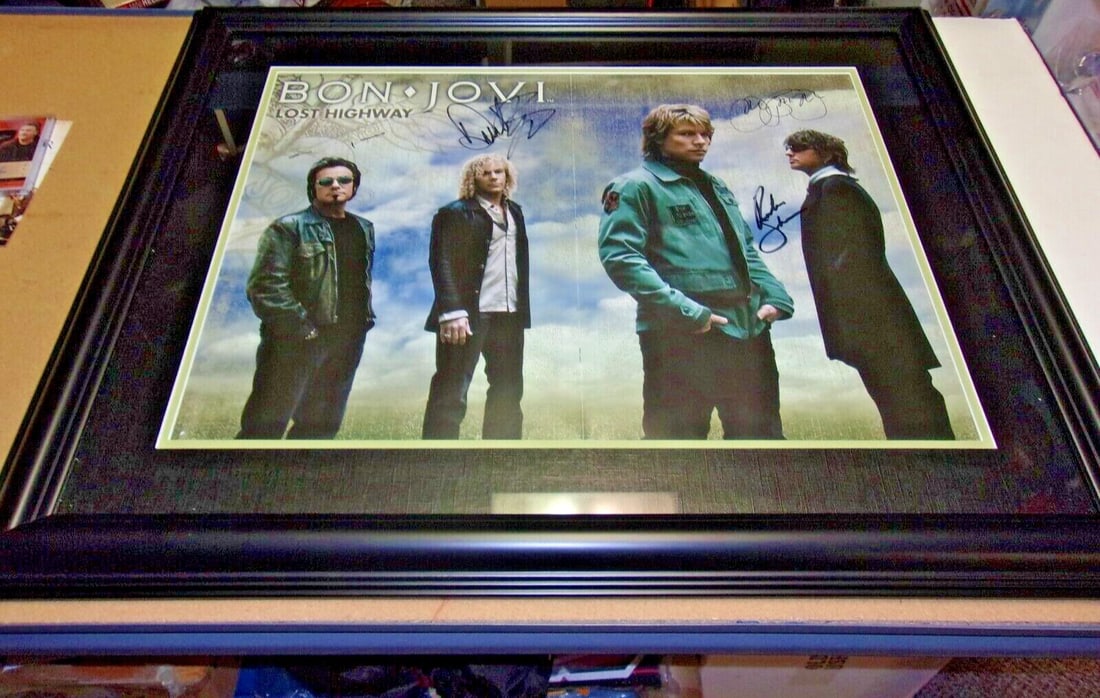 Framed 21x26 Rock Band Photo Signed by Jon Bon Jovi Richie Sambora Plus Two COA: Framed 21x26 Rock Band Photo Signed by Jon Bon Jovi Richie Sambora Plus Two COA This is an original 21x26 inch photograph signed by Jon Bon Jovi, Richie Sambora, and two additional full band members. 
