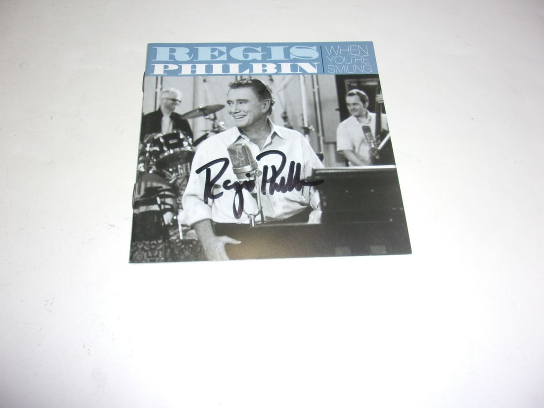 Signed Regis Philbin When You're Smiling CD Cover With COA: Signed Regis Philbin When You're Smiling CD Cover With COA This item is an original CD cover signed by Regis Philbin for "When You're Smiling." It comes with a certificate of authenticity. The piece o