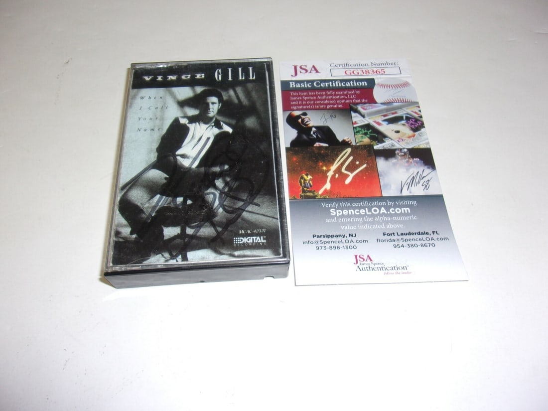 Vince Gill signed When I Call Your Name cassette with JSA COA: Vince Gill signed When I Call Your Name cassette with JSA COA This is an original cassette tape album of "When I Call Your Name" by Vince Gill, signed by the artist. The item includes authentication f