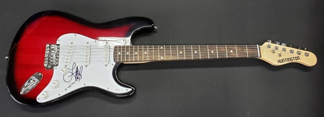 Electric Guitar Signed by Lauren Alaina with JSA Authentication: Electric Guitar Signed by Lauren Alaina with JSA Authentication This is an original electric guitar autographed by country star Lauren Alaina. The signature has been authenticated by James Spence Auth