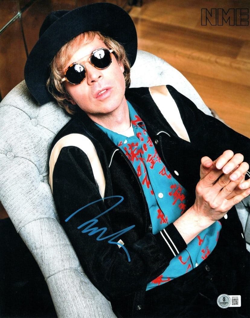 Beck Hansen Autographed 11x14 Photo Sunglasses Beckett Authenticated: Beck Hansen Autographed 11x14 Photo Sunglasses Beckett Authenticated This is an original 11x14 photograph of Beck Hansen, famously known for his unique style and musical contributions, featuring him i