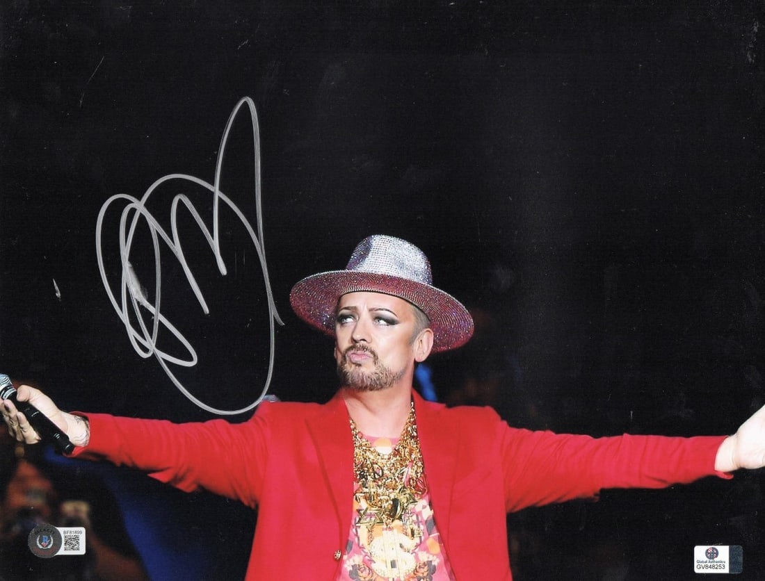 Boy George Autographed 11X14 Photo Culture Club Beckett Certified: Boy George Autographed 11X14 Photo Culture Club Beckett Certified This is a signed 11X14 photograph of Boy George, the iconic singer from the Culture Club. The autograph has been authenticated by Beck