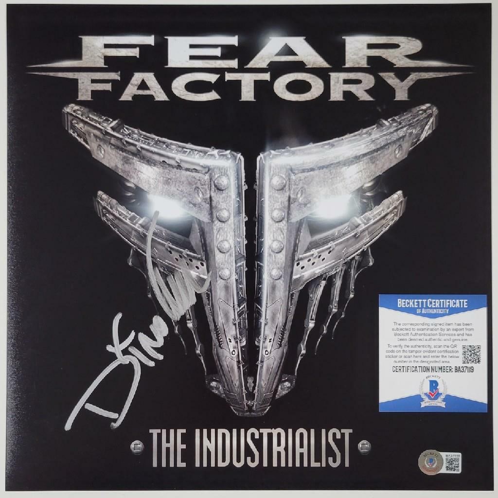 Signed 12x12 Photo of Dino Cazares from Fear Factory with Beckett COA: Signed 12x12 Photo of Dino Cazares from Fear Factory with Beckett COA This is an original 12x12 inch photograph signed by Dino Cazares of Fear Factory. The autograph is authenticated by Beckett (BAS C