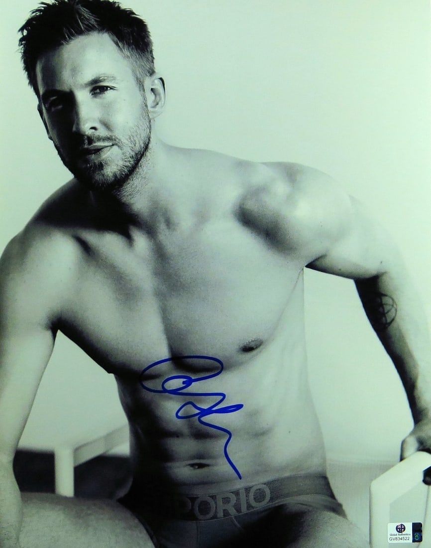 Autographed 11x14 Black and White Photo Calvin Harris With GAI Authentication: Autographed 11x14 Black and White Photo Calvin Harris With GAI Authentication This is an original 11x14 black and white photograph autographed by Calvin Harris. The signature has been authenticated by