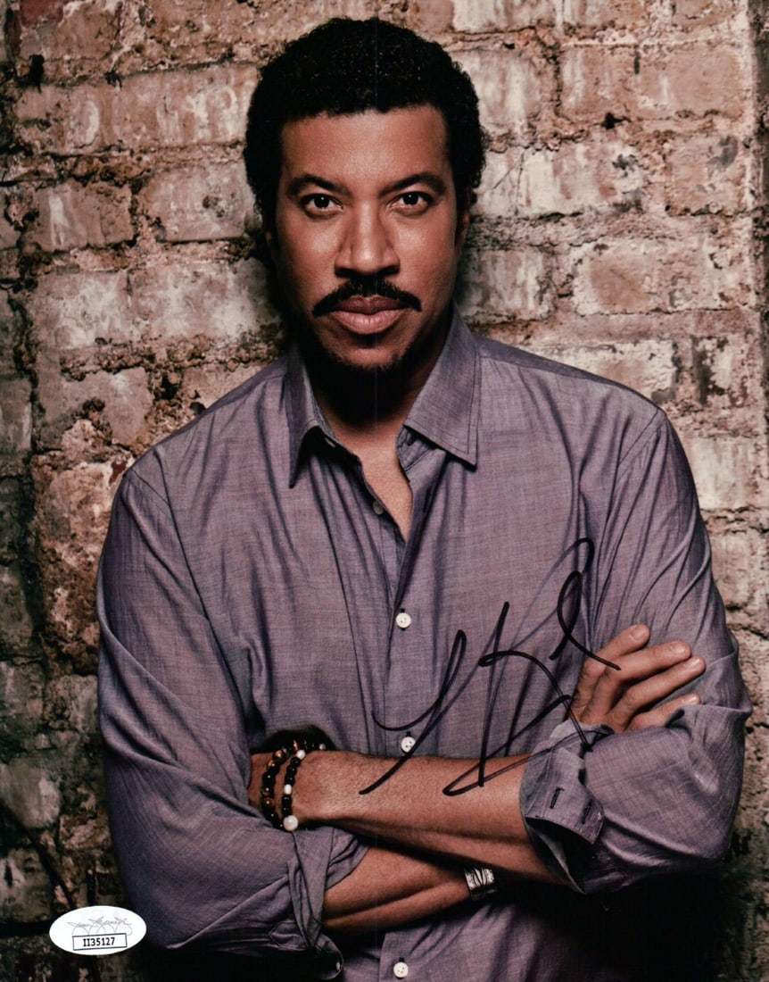 Lionel Ritchie Autographed 8x10 Photo Brick Wall JSA Certified: Lionel Ritchie Autographed 8x10 Photo Brick Wall JSA Certified Celebrate the music legend with this authentic, autographed 8x10 photograph of Lionel Richie in a captivating pose against a sexy brick w