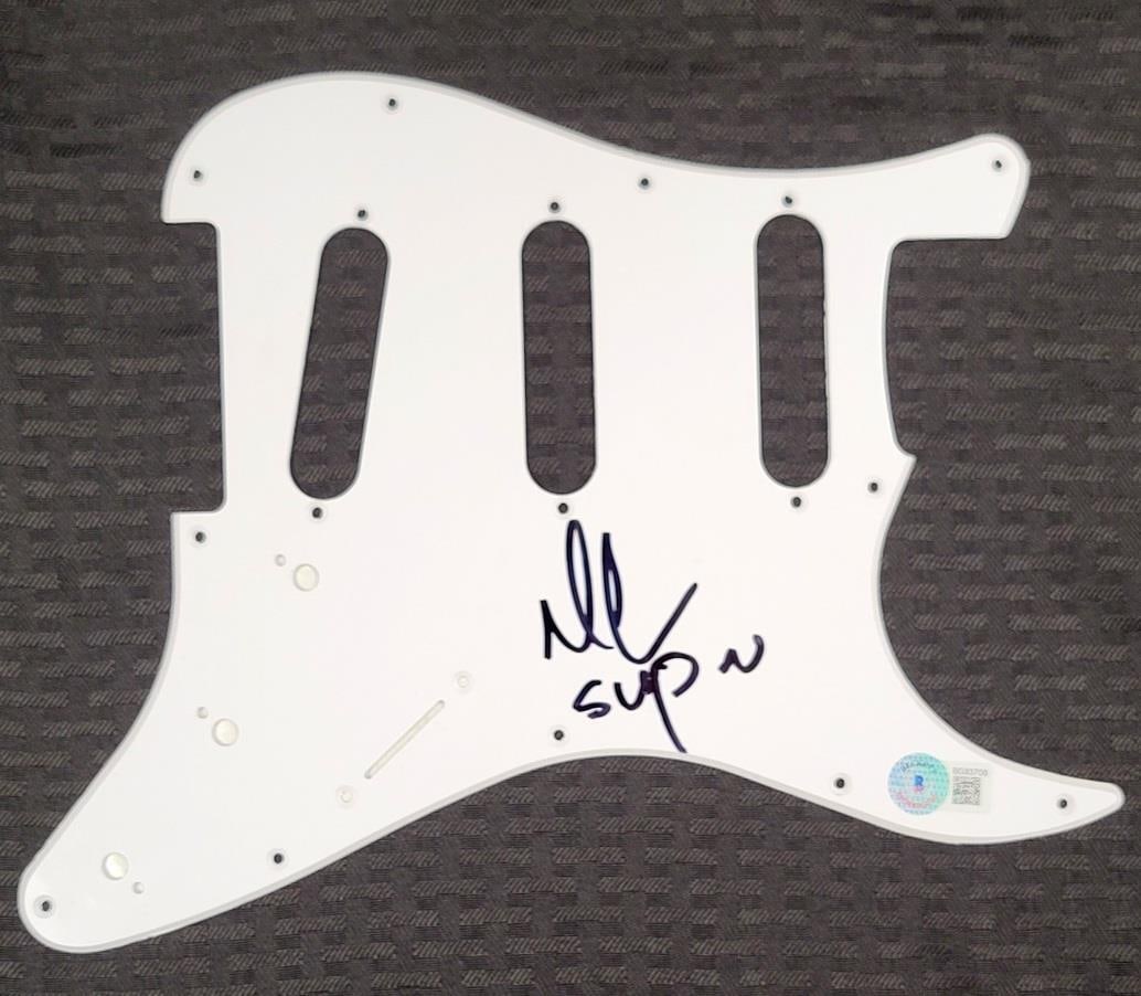 Mark McGrath Autographed Sugar Ray Guitar Pickguard Beckett Authenticated: Mark McGrath Autographed Sugar Ray Guitar Pickguard Beckett Authenticated This is an original electric guitar pickguard signed by Mark McGrath of Sugar Ray. The autograph is authenticated by Beckett a