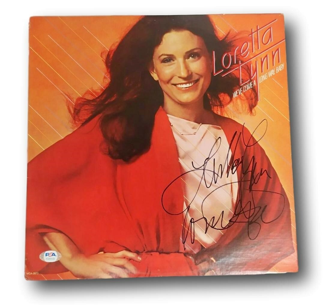Loretta Lynn We've Come A Long Way Signed Album PSA/DNA Authentic: Loretta Lynn We've Come A Long Way Signed Album PSA/DNA Authentic This is an original record album of Loretta Lynn titled "We've Come A Long Way". The album is autographed by the artist and comes with