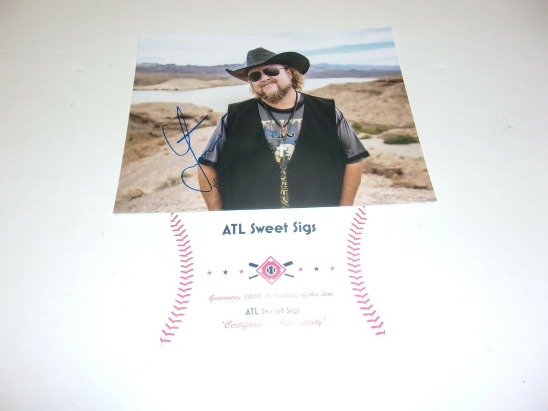 Signed Colt Ford 8x10 Photograph With USA Flag and Certificate of Authenticity: Signed Colt Ford 8x10 Photograph With USA Flag and Certificate of Authenticity This is an original 8x10 photograph featuring Colt Ford, the country music artist. The photo is signed and comes with a C