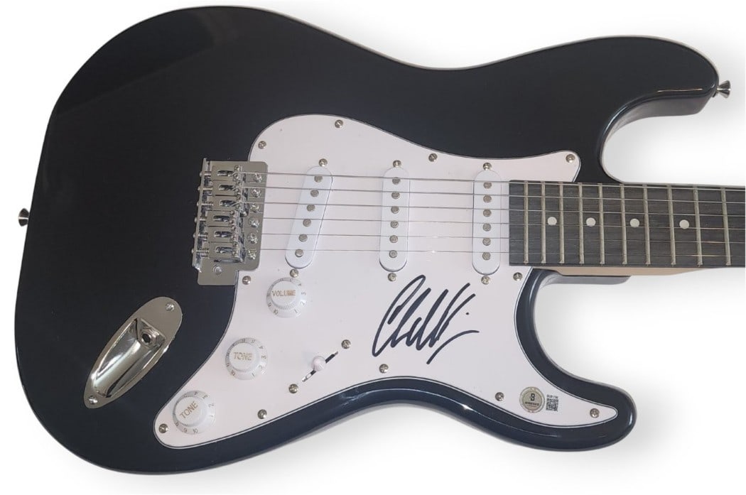 Chad Kroeger Signed Electric Guitar Nickelback Beckett Authenticated: Chad Kroeger Signed Electric Guitar Nickelback Beckett Authenticated This is an original electric guitar signed by Chad Kroeger, the renowned guitarist of Nickelback. The guitar comes with a Beckett A
