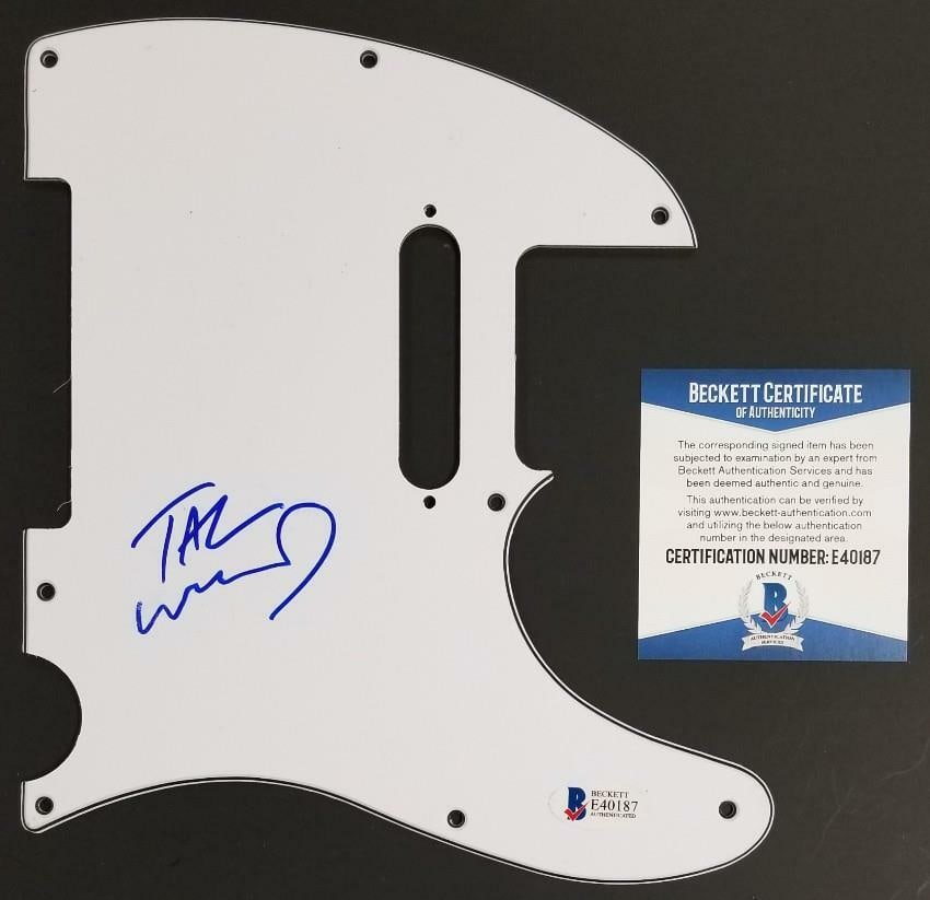 Autographed Pickguard by Tal Wilkenfeld with Beckett BAS Authentication: Autographed Pickguard by Tal Wilkenfeld with Beckett BAS Authentication This is an original guitar pickguard signed by Tal Wilkenfeld, renowned bassist. The autograph is authenticated by Beckett BAS C