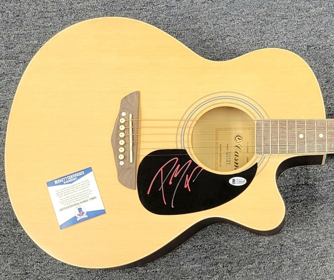 Full Size Acoustic Guitar Signed by Post Malone with Beckett BAS COA: Full Size Acoustic Guitar Signed by Post Malone with Beckett BAS COA This full size acoustic guitar features the autograph of rapper Post Malone. It comes with a Beckett BAS Certificate of Authenticit