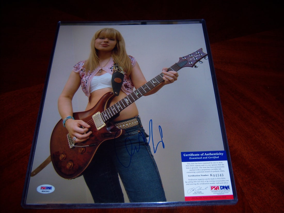11x14 Autographed Orianthi Panagaris Photo with PSA DNA Authentication: 11x14 Autographed Orianthi Panagaris Photo with PSA DNA Authentication This is an original 11x14 photograph signed by Orianthi Panagaris. The photo is from the United States and is in pre-owned condit