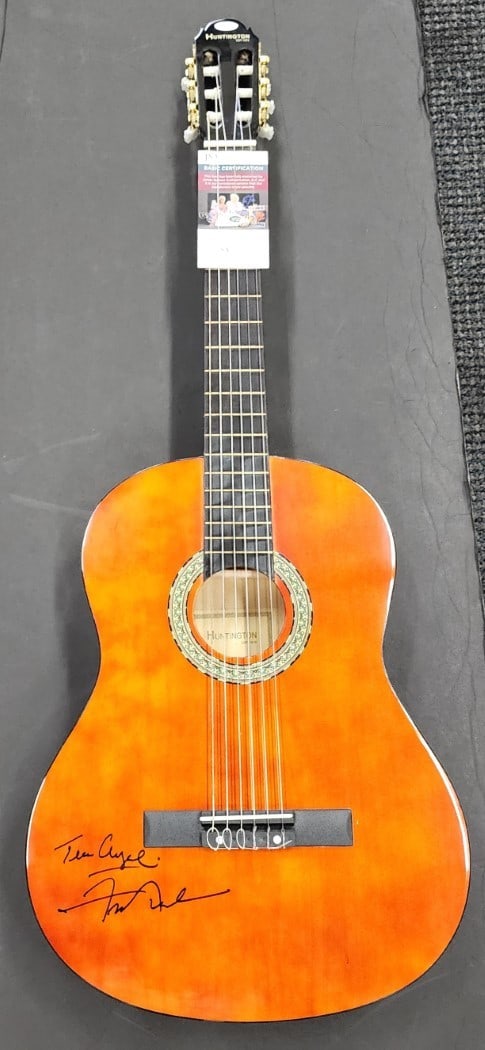Frankie Avalon Autographed Acoustic Guitar Teen Angel JSA Certified: Frankie Avalon Autographed Acoustic Guitar Teen Angel JSA Certified This is an original acoustic guitar autographed by Frankie Avalon, featuring the inscription "Teen Angel." The autograph has been au