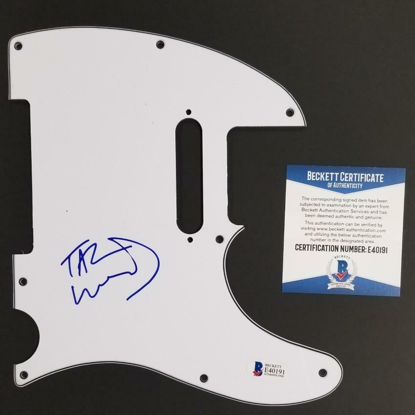 Autographed Pickguard by Tal Wilkenfeld with Beckett BAS Authentication: Autographed Pickguard by Tal Wilkenfeld with Beckett BAS Authentication This is an original guitar pickguard signed by renowned bassist Tal Wilkenfeld. The autograph has been authenticated by Beckett 