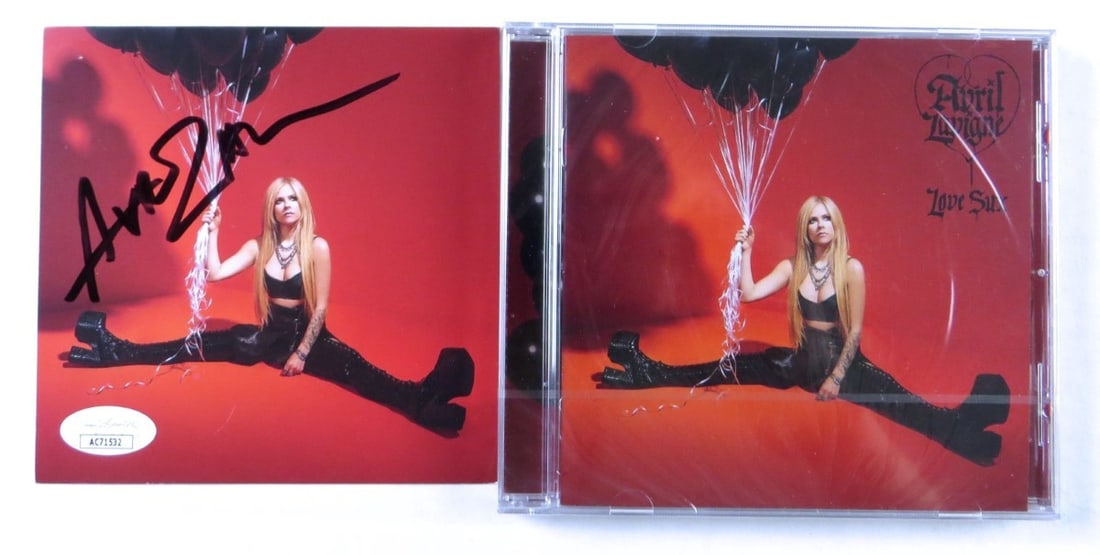 Love Sucks CD Insert Signed by Avril Lavigne with JSA Authentication and Sealed Album: Love Sucks CD Insert Signed by Avril Lavigne with JSA Authentication and Sealed Album This is an original CD insert for Avril Lavigne's "Love Sucks," personally signed by Avril Lavigne. The autographe