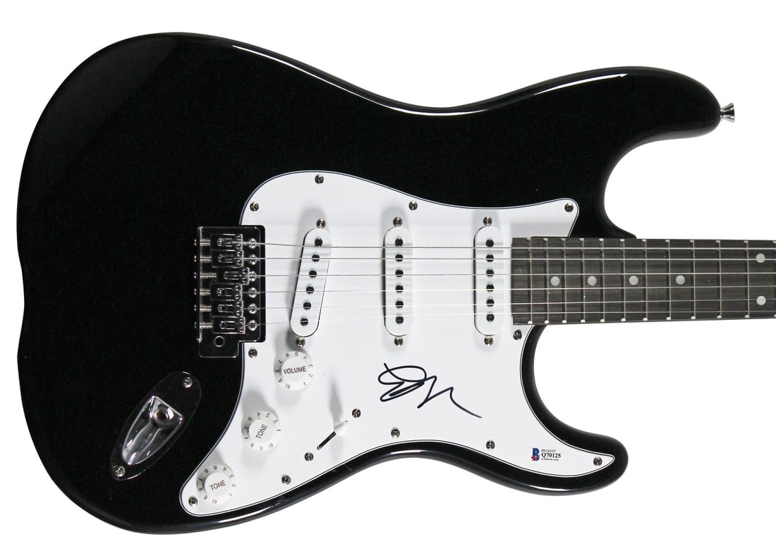 Black Electric Guitar Signed by Emily Ratajkowski with Beckett COA: Black Electric Guitar Signed by Emily Ratajkowski with Beckett COA This black electric guitar has been personally autographed by Emily Ratajkowski. The authenticity of the signature is verified by Bec