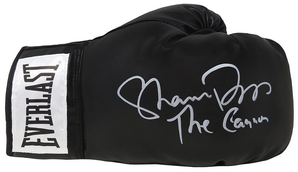 Shannon Briggs Signed Everlast Boxing Glove The Cannon COA: Shannon Briggs Signed Everlast Boxing Glove The Cannon COA Own a remarkable piece of boxing history with this Shannon Briggs signed black Everlast boxing glove. The glove features the inscription 'The