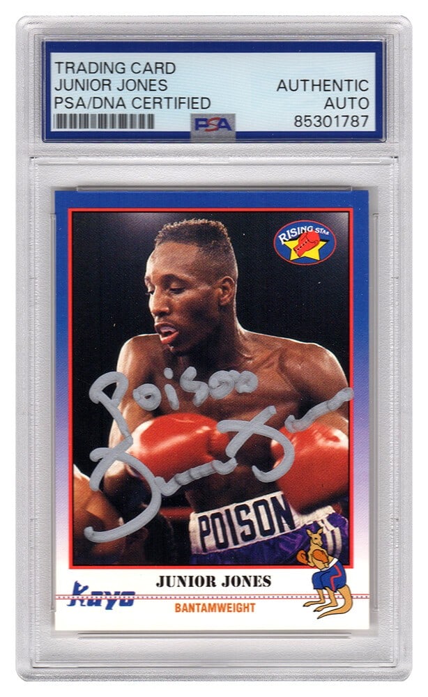 Junior Jones Signed 1991 Kayo Boxing Card #231 PSA Encapsulated with Poison Inscription: Junior Jones Signed 1991 Kayo Boxing Card #231 PSA Encapsulated with Poison Inscription This item features a signed 1991 Kayo boxing trading card #231 of Junior Jones, adorned with the inscription 'Po