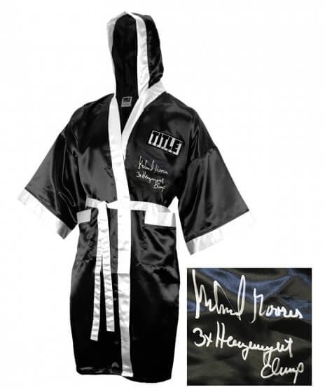 Michael Moorer Signed Black Boxing Robe 3x Heavyweight Champ with COA: Michael Moorer Signed Black Boxing Robe 3x Heavyweight Champ with COA This Michael Moorer signed Title black full-length boxing robe is a remarkable piece for boxing enthusiasts. It features the inscr