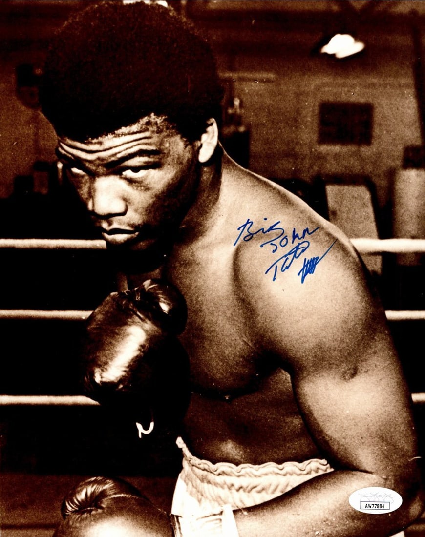Big John Tate Autographed 8x10 Boxing Photo JSA Certified: Big John Tate Autographed 8x10 Boxing Photo JSA Certified This is an 8x10 black and white boxing photo signed by Big John Tate, a notable figure in the sport. The photo comes with authentication from 