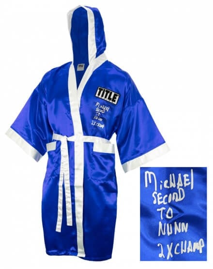 Michael Nunn Signed Title Blue Boxing Robe 2x Champ with COA: Michael Nunn Signed Title Blue Boxing Robe 2x Champ with COA This Michael Nunn signed Title blue boxing robe is a remarkable collectible for boxing enthusiasts. Featuring inscriptions of '2x Champ' an