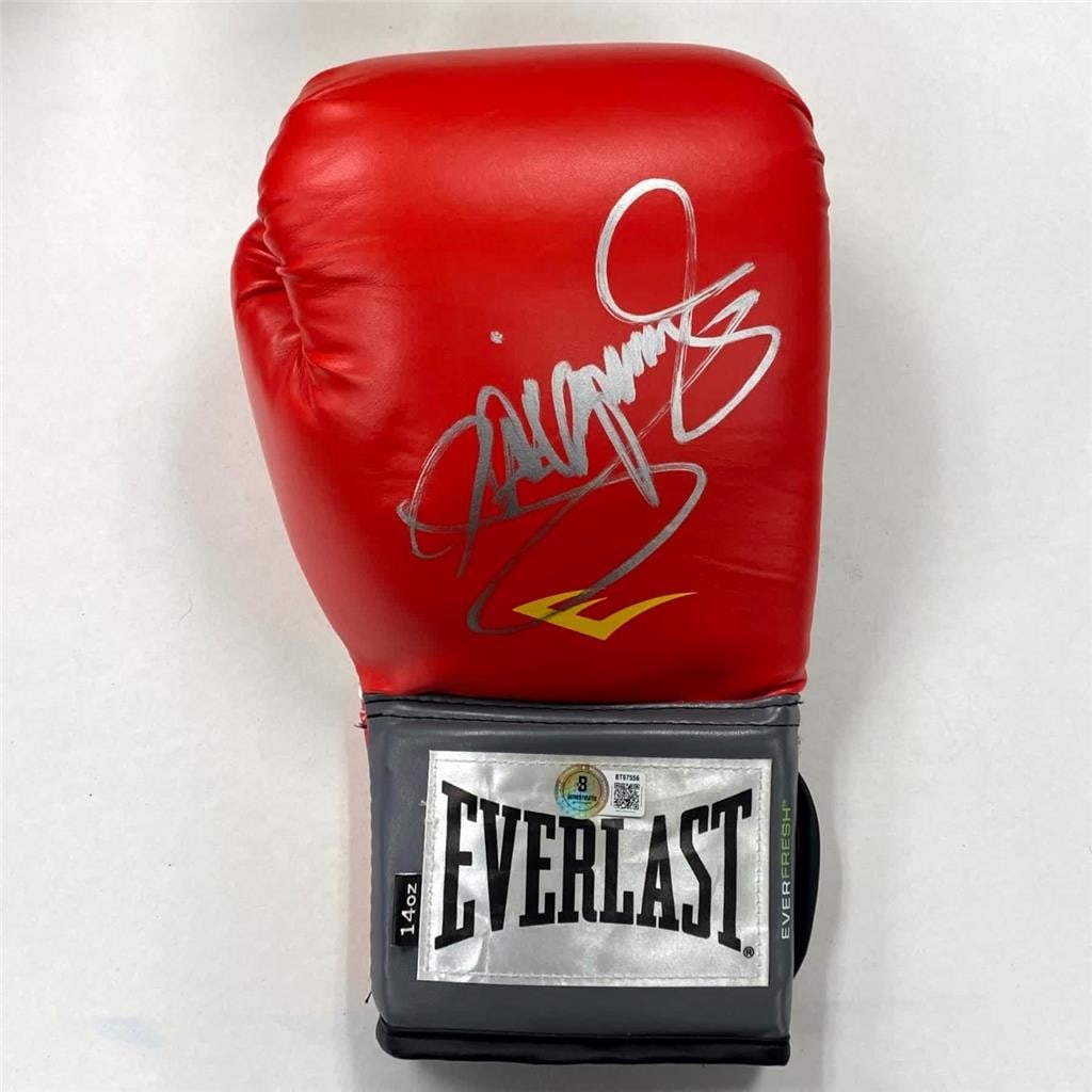 Beckett authenticated Manny Pacquiao autographed red boxing glove: Beckett authenticated Manny Pacquiao autographed red boxing glove This is a red Everlast boxing glove personally autographed by Manny Pacquiao. The signature has been authenticated by Beckett Authenti