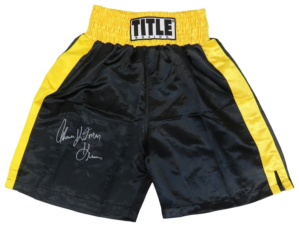 Thomas Hearns Signed Black Yellow Boxing Trunks with Hitman Inscription COA: Thomas Hearns Signed Black Yellow Boxing Trunks with Hitman Inscription COA Own a piece of boxing history with these original black and yellow boxing trunks signed by the legendary Thomas Hearns. Feat