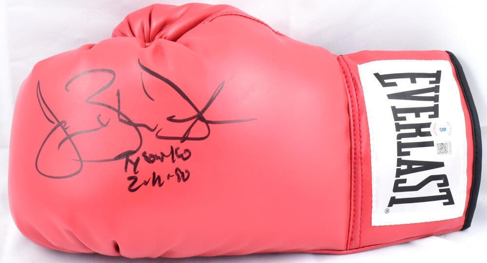 Buster Douglas autographed Everlast red left boxing glove Beckett holo: Buster Douglas autographed Everlast red left boxing glove Beckett holo This Everlast red boxing glove is hand-signed by Buster Douglas and features the inscription "Tyson KO." The autograph is authent