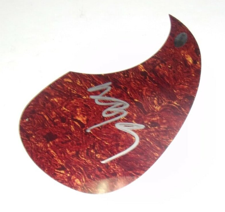 Willie Nelson Autographed Guitar Pick Guard With Certificate of Authenticity: Willie Nelson Autographed Guitar Pick Guard With Certificate of Authenticity This is an original guitar pickguard signed by Willie Nelson. The item originates from the United States and comes with a c