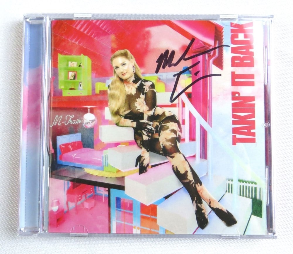 Meghan Trainor Signed CD Booklet Takin' It Back Beckett Authenticated: Meghan Trainor Signed CD Booklet Takin' It Back Beckett Authenticated This is an original autographed CD booklet of Meghan Trainor's album 'Takin' It Back', authenticated by Beckett Authentication. Th