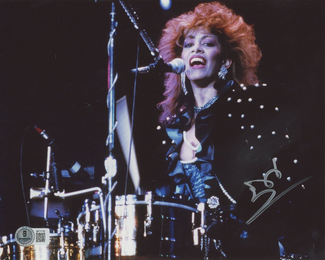 Sheila E. The George Duke Band Signed 8x10 Photo BAS Certified: Sheila E. The George Duke Band Signed 8x10 Photo BAS Certified This authentic 8x10 photograph features the signature of Sheila E., a renowned member of The George Duke Band. The item is guaranteed 100