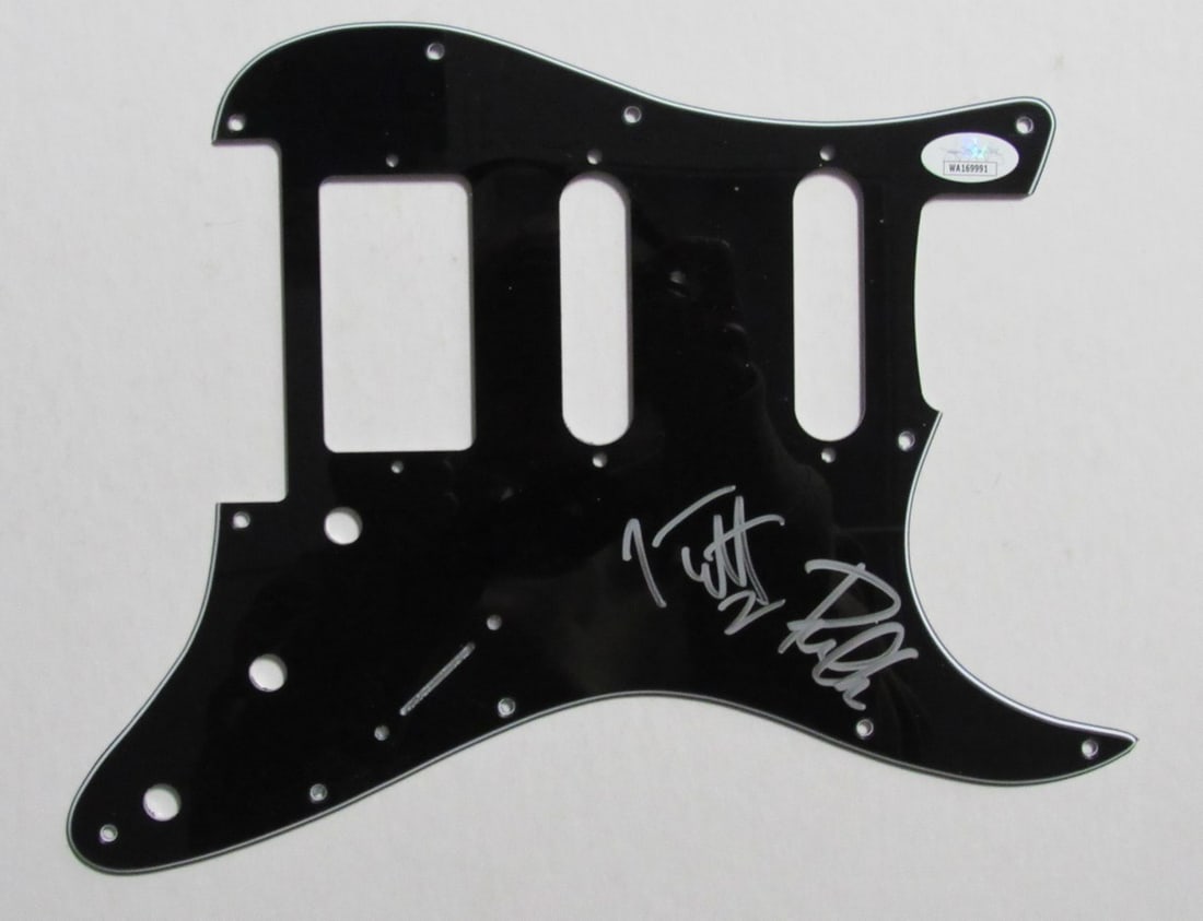 Def Leppard Pick Guard Signed by Joe Elliott and Phil Collen JSA: Def Leppard Pick Guard Signed by Joe Elliott and Phil Collen JSA This is an original guitar pick guard hand signed by Joe Elliott and Phil Collen of Def Leppard. The autographs are authenticated by Ja