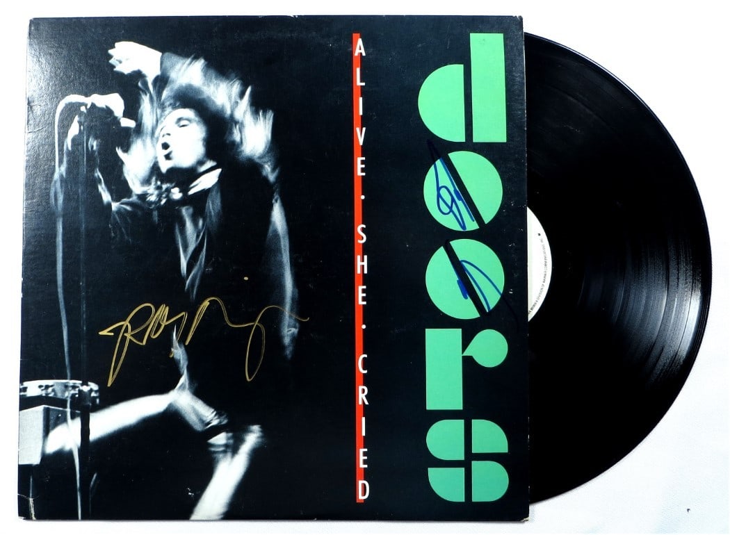 Beckett Authenticated Doors album signed by Densmore and Krieger: Beckett Authenticated Doors album signed by Densmore and Krieger This is an original record album autographed by John Densmore and Robby Krieger of The Doors. The signatures have been authenticated by