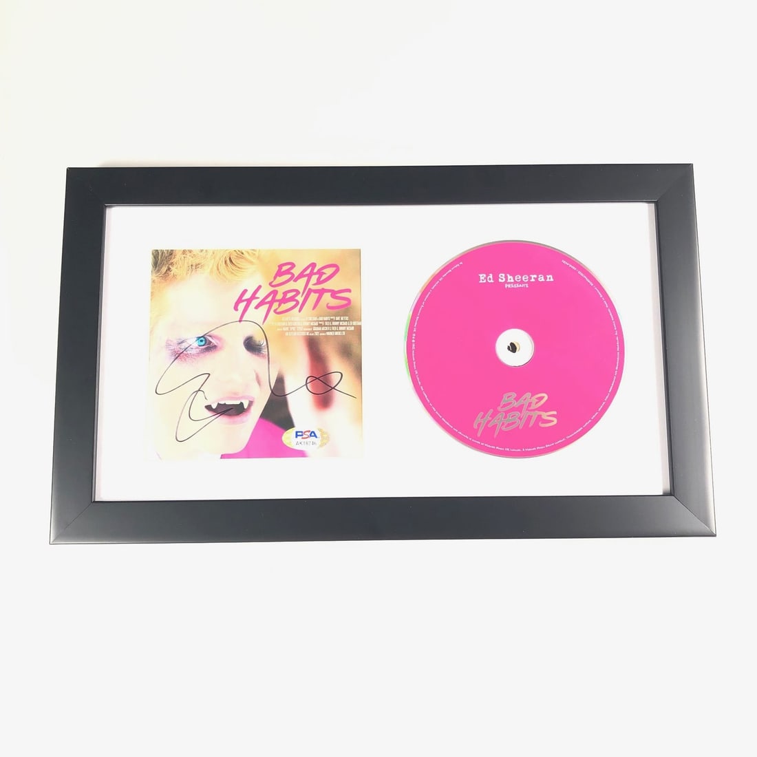 Ed Sheeran Bad Habits Signed Framed CD Cover PSA/DNA Authenticated: Ed Sheeran Bad Habits Signed Framed CD Cover PSA/DNA Authenticated This framed CD album cover features the authentic signature of Ed Sheeran, showcasing his autograph on the 'Bad Habits' cover. Authen