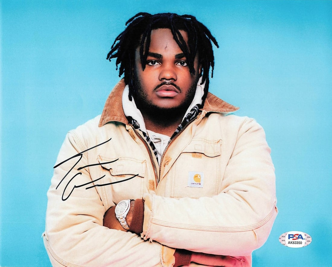 TEE GRIZZLEY Autographed 8x10 Photo PSA/DNA Certified Authentic: TEE GRIZZLEY Autographed 8x10 Photo PSA/DNA Certified Authentic This is an original 8x10 photograph featuring Tee Grizzley, a well-known rapper, personally signed by him. The authenticity of the signa