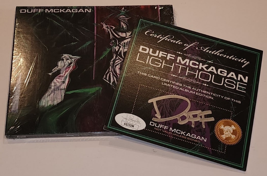 Duff McKagan Signed CD & Booklet with JSA Authentication: Duff McKagan Signed CD & Booklet with JSA Authentication This listing features a signed insert from Duff McKagan's 'Lighthouse' CD, authenticated by James Spence Authentication (JSA). The insert is or