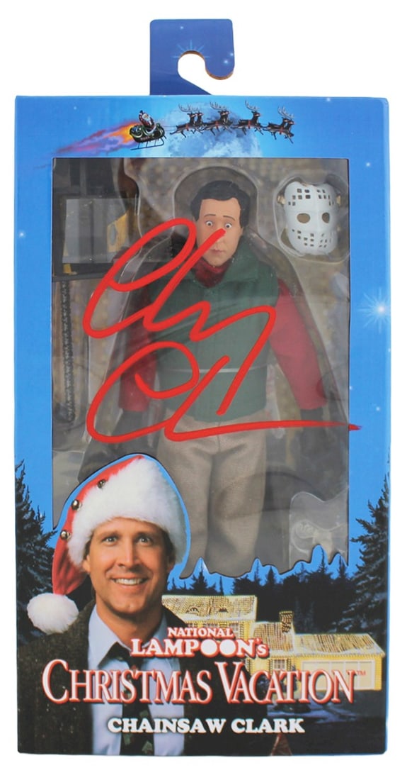 Chevy Chase Signed Chainsaw Clark Figure Beckett COA National Lampoon Christmas Vacation: Chevy Chase Signed Chainsaw Clark Figure Beckett COA National Lampoon Christmas Vacation This NECA Chainsaw Clark figure from National Lampoon's Christmas Vacation has been personally signed in red by