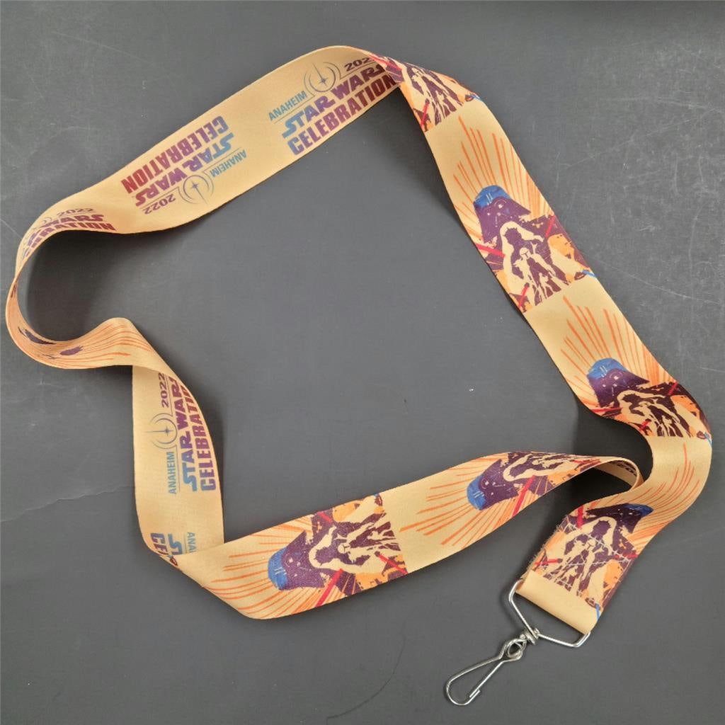 Official Star Wars Celebration Anaheim 2022 Event Lanyard Collectible: Official Star Wars Celebration Anaheim 2022 Event Lanyard Collectible This is an official lanyard art from Star Wars Celebration 2022 held in Anaheim. It features artwork related to the Star Wars fran