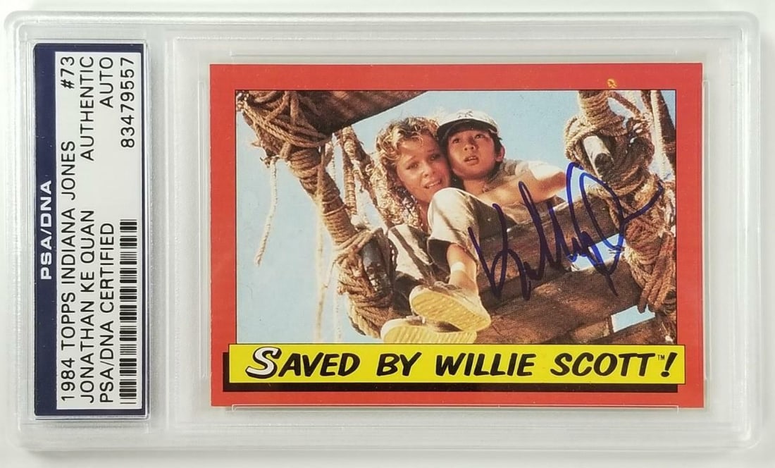 Jonathan Ke Quan Signed 1984 Topps Indiana Jones #73 Card PSA Authenticated: Jonathan Ke Quan Signed 1984 Topps Indiana Jones #73 Card PSA Authenticated This collectible card features Jonathan Ke Quan's autograph and is from the 1984 Topps series, depicting a scene from the mo