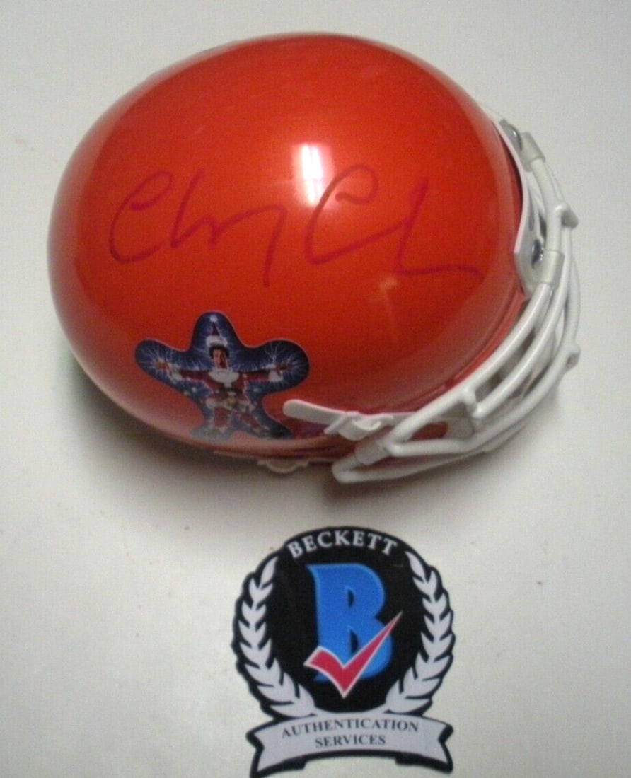 Mini Helmet Autographed by Christmas Vacation Star with Beckett COA: Mini Helmet Autographed by Christmas Vacation Star with Beckett COA This mini helmet is hand-signed by actor Chevy Chase, known for his role in "Christmas Vacation." The item is an original piece and 