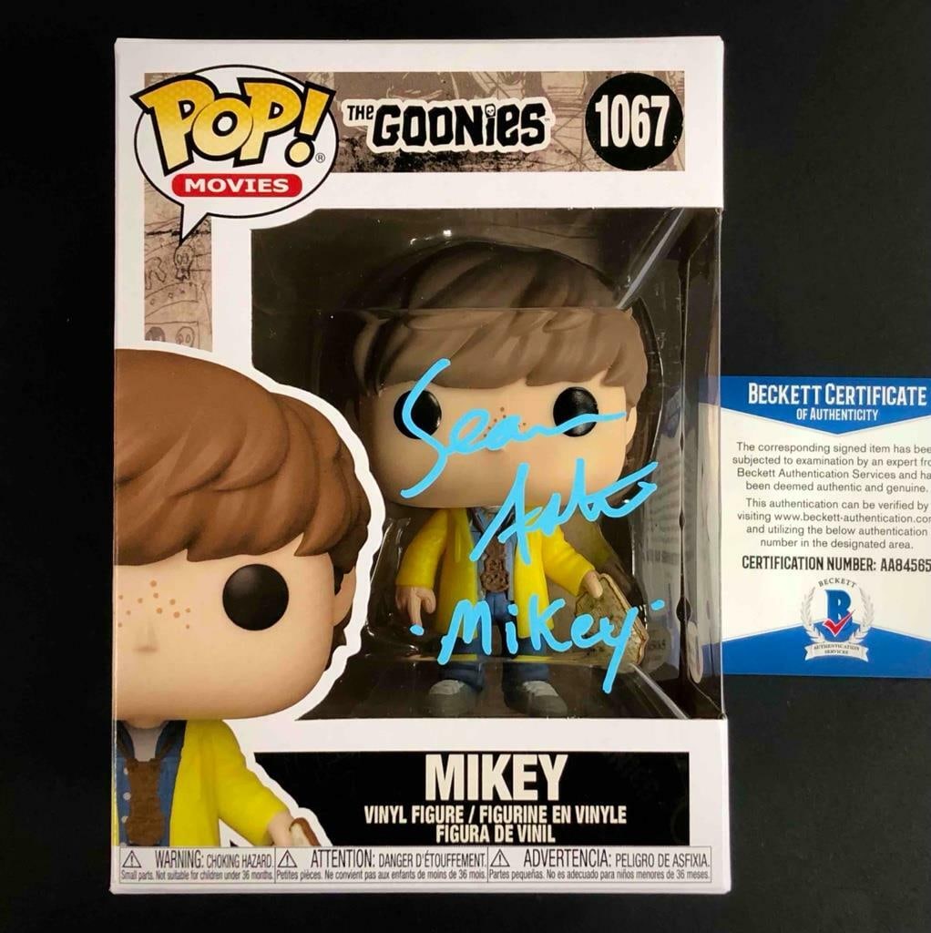 Funko Pop The Goonies Mikey Signed by Sean Astin Beckett Authenticated: Funko Pop The Goonies Mikey Signed by Sean Astin Beckett Authenticated This is an original Funko Pop #1067 figure from The Goonies, featuring Mikey, autographed by Sean Astin. The signature has been a
