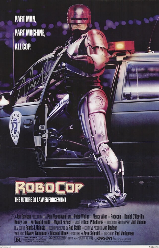 Nancy Allen Signed Robo Cop Poster 11x17 in Silver with COA: Nancy Allen Signed Robo Cop Poster 11x17 in Silver with COA This original 11x17 movie poster features the signature of Nancy Allen, known for her role in Robo Cop. The autograph is beautifully rendere