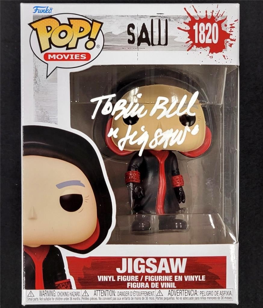 Saw Jigsaw Funko Pop 1820 Tobin Bell signed Beckett BAS Witness: Saw Jigsaw Funko Pop 1820 Tobin Bell signed Beckett BAS Witness This Funko Pop! figure from the movie "Saw," featuring the character Jigsaw, is hand-signed by Tobin Bell. The autograph has been authen